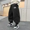 Pantalones de otoño para niños 2026 nuevo estilo para niños mayores primavera y otoño pantalones deportivos holgados estilo coreano