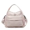 Bolsa Pequeña Ligera de Nailon Casual Estilo Japonés 2025 Nueva Moda Bolso de Hombro Único Cruzado Portátil para Viajero Bolso para Cámara