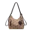 Bolsas de mano de lujo ligero estilo coreano al por mayor para mujer, nuevos bolsos de hombro elegantes de lunares para otoño 2026, mochilas versátiles