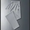 2025 Novo Calça Jogger Masculina de Verão com Cordão Solta Estilo Coreano Tendência Elástica Casual Esportiva