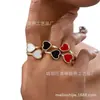 Nuevo diseño de anillo con incrustaciones de amor acrílico metálico tridimensional europeo y americano, exquisitos accesorios de joyería de amor para mujer
