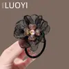 2025 Novo Estilo Coreano de Luxo Leve Brilhante Diamante Flor de Quatro Folhas Rede Elástica para Cabelo para Mulheres, Acessório de Cabelo Simples Moderno e Versátil