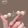 Nuevo pasador de pelo de perlas de lujo ligero estilo coreano y japonés, pinza lateral, pinza para flequillo dulce, pinza de pico de pato, accesorio para el pelo con lazo de diamantes de imitación