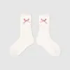 1746 calcetines infantiles al por mayor, calcetines de media caña bordados con lazo, estilo Miu girl, calcetines de algodón sin costuras con puños holgados para niñas
