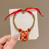 Pulsera de Hilo de Colores del Festival del Bote del Dragón Año del Zodiaco Joyería Tradicional Simple Lujo Ligero Pulsera Roja Modelo Nuevo 2026 Pulsera