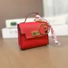 Mini cartera, charm de bolso de lujo, mini bolso de platino, llavero de coche lindo y creativo, bolsa para lápiz labial y audífonos