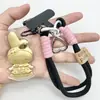 Chaveiro de Ouro Puro 999 Melodia Fofo Criativo Desenho Animado Cordão Corrente para Celular Bolsa Pingente Presente