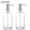 Suministro directo de fábrica botella de vidrio transparente botella Boston 500ml cabeza de bomba de presión de acero inoxidable botella de gel de ducha dispensador de jabón