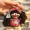 Encantador perrito peludo con la lengua fuera, llavero para bolso, colgante de dibujos animados natural, semillas de terapia de sonido curativas, popular en zonas escénicas, amuleto divertido y adorable
