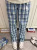 Pantalones largos casuales de otoño para hombre estilo americano, a cuadros azules, con cordón, corte recto holgado, moda masculina, nuevo estilo 2026, adecuados para estudiantes