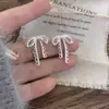 Pendientes Minimalistas Versátiles de Plata Huecos con Forma de Lazo Diseño de Nicho Moda Simple Versátiles Exquisitos Dulces Pendientes de Moda