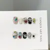 Puntas de uñas cortas de alta gama hechas a mano y de colores con lindos pedrería en forma de corazón europeos y americanos, parches de uñas postizas brillantes