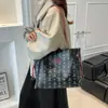 Bolso Tote de Textura Casual de Gran Capacidad 2025 Nuevo Diseño de Nicho para Mujer Popular Estilo Extranjero Bolso Bandolera de Viaje Bolso de Hombro