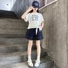 Traje de Verano para Niñas 2025 Nueva Moda Niña Estilo Coreano Estilo Infantil Mediano y Grande Letra Manga Corta Shorts de Mezclilla Trendy