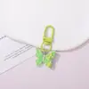 Llavero de resina con forma de mariposa de colores pastel, estilo lindo y dulce, colgante femenino, suministro para puestos callejeros y mercados nocturnos, accesorios de alta calidad al por mayor