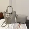 Bolso de cubo nuevo y sencillo, moda de primavera, bolso de hombro y bandolera minimalista texturizado, bolso de mano para mujer para el trabajo, bolso de exportación