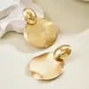 Brincos transfronteiriços estilo europeu e americano, tachas de design minimalista redondo com textura metálica de nicho, acessórios de orelha versáteis e únicos estilosos