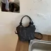 Bolso de mano para mujer estilo coreano para el trabajo y los desplazamientos, nuevo modelo primavera 2026, bolso de cubo de moda nicho para hombro y axila