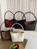 Bolsa de mão com padrão trançado transfronteiriça para mulheres, nova bolsa de ombro versátil e moderna com textura de grande capacidade, estilo férias