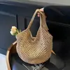 Bolsa de palha super popular do verão para mulheres, novo modelo 2026, estilo artístico, bolsa de praia de tricô para férias, bolsa de ombro e transversal