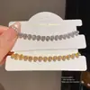 Pulsera con Cierre de Corazón de Circonia Chapada en Oro Real de 18k Pulsera de Lujo Ligero de Alta Gama Estilo Frío Personalidad Joyería de Mano Venta al por Mayor