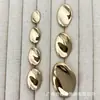 Botones metálicos ovalados con forma de huevo, adecuados para trajes, abrigos de lana de punto y otras prendas.; botones decorativos simples y versátiles para coser a mano