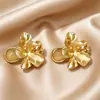 Nuevos pendientes de botón flor de oro retro estilo chino, diseño simple y único, pendientes elegantes y lujosos de lujo ligero para mujer