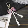 Nuevo llavero con lazo acrílico, colgante con personalidad, colgante para bolso, funda para auriculares, cadena, joyería
