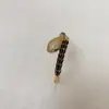 Conjunto de Pulsera y Anillo de Serpiente Cascabel con Goteo de Aceite Chapado en Cobre Oro de 18 Quilates Incrustado con Circonita Nuevo Ingreso de Lujo de Nicho Transfronterizo Europeo y Americano