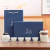 Juego de té de viaje traje portátil para exteriores juego de té kung fu taza rápida de cerámica empresa mayorista regalos publicitarios de negocios