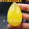 Cera de abeja al por mayor fluorescente flotante agua salada mango de cera de abeja colgante Hu cera de abeja color amarillo aceite de pollo colgante Buda Guanyin cabello de cera de abeja vieja