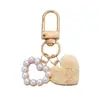 Llavero con Forma de Corazón de Concha de Perla Creativo Llavero de Concha Caracola Pequeño Regalo Ins Colgante Pequeño