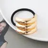 Estilo punk europeo y americano metal personalidad alta calidad cuerda para la cabeza semicírculo tubo redondo anillo para el pelo cuerda elástica para el pelo Balot fabricantes al por mayor