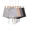 Verano Nuevo Sexy Spice Girl Falda de Cintura Baja Falda Corta de Mujer Anti-corriente Ligera Línea A Cadera con Ropa Interior Wei Falda Culottes