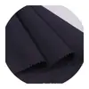 Tejido especial para bolsas de exterior, hecho de nailon totalmente reciclado con tres compartimentos, ligero, lavable, resistente al desgarro, libre de flúor e impermeable.