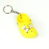 Llavero de Zapatos de Cueva Caliente Transfronterizos Mini Dibujo Animado Zapatitos Pequeños Llavero de Coche Colgante para Pareja Regalos Venta al por Mayor