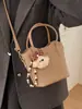 2026 Bolsa Casual da Moda Estilo Novo com Textura Simples e Moderna, Bolsa Saco para Inverno, Bolsa de Ombro e Transversal Personalizada para Mulheres