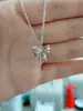 2023 Nuevo collar de mariposa hueca hip hop todo partido colgante de mariposa de circón accesorios de moda geniales para la tierra sentido del diseño