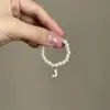 Mini Labubu Cuarta Generación Caja Sorpresa Ropa de Muñeca Collar Colgante Labubu 26 Letras Collar de Perlas Accesorios de Joyería