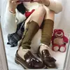 Versión coreana de encaje botón decorativo acrílico corto calcetines de Corea del Sur lana sueltos calcetines de felpa para mujer botas zapatos al por mayor