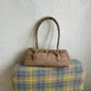 Tendência de moda 2026: bolsa de ombro retrô, minimalista e única, uma nova coleção de verão com bolsas de ombro texturizadas e estilosas para mulheres