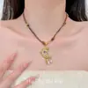 Collar con colgante de luna dorada estilo vintage para mujer, accesorio de cadena larga trenzada para suéter retro de alta gama