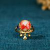 Elyuan anillo vintage con diseño de nicho chapado en oro antiguo, imitación jade Hetian, esmalte cloisonné, flor de perla y capullo