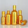 En stock frasco de cuenta dorada galvanizada columna de acero frasco de perfume cuenta de vidrio cosmético para masaje frasco de aceite esencial 30ml100ml