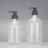 En stock botella redonda de hombro de 500 ml para gel de ducha botella de champú con dispensador empaque cosmético para rellenar PET esmerilado