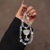 Nueva Cadena para Teléfono Móvil Cadena Colgante de Cristal Diseño de Gama Alta Pequeño Nicho Sentido del Diseño Exquisito Correa Colgante de Muñeca para Mujer Accesorios para Bolsos