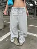 Outono/Inverno Novo Estilo Transfronteiriço Estilo Coreano Streetwear Botão Patchwork Design de Personalidade Unissex Versátil Cor Sólida Calça Longa Atacado