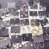 Pendientes elegantes de aro de metal estilo francés de alta calidad, estilo frío, ligeros, de lujo, a la moda, elegantes, combinables con todo, estilo europeo, con hebilla para la oreja.