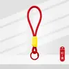 Lanyard de Color de Moda con Llavero de Peluche Trenzado Corto para Teléfono Hebilla Única Hebilla Sola Fabricante de Colgante de Llavero de Peluche En Stock Fuente