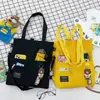 2025 Nuevo Estilo Coreano Bolso de Lona de Color Puro Simple Mochila Ligera Moda para Estudiante de Primaria Bolso Tote Escolar de Moda